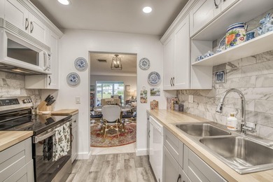 Enjoy the best of South Florida living in this beautifully on  in Florida - for sale on GolfHomes.com, golf home, golf lot