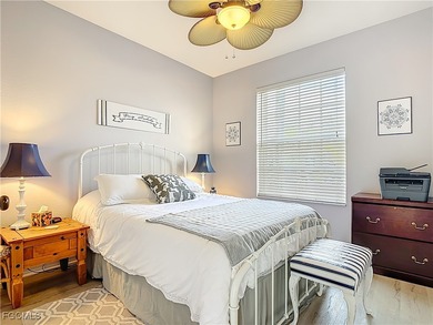 Expanded IBIS II pool home with serene lake and fountain views on Herons Glen Golf and Country Club in Florida - for sale on GolfHomes.com, golf home, golf lot