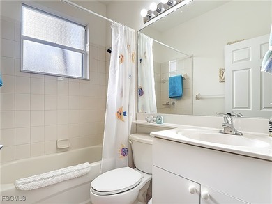 Expanded IBIS II pool home with serene lake and fountain views on Herons Glen Golf and Country Club in Florida - for sale on GolfHomes.com, golf home, golf lot