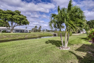 Enjoy the best of South Florida living in this beautifully on  in Florida - for sale on GolfHomes.com, golf home, golf lot