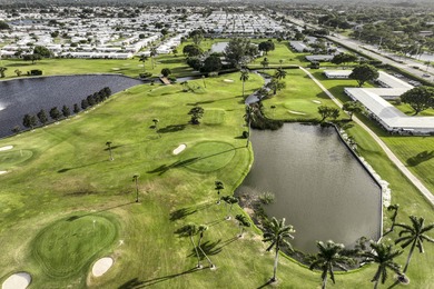 Enjoy the best of South Florida living in this beautifully on Leisureville Community Golf Course in Florida - for sale on GolfHomes.com, golf home, golf lot