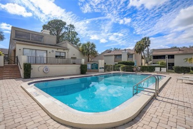 FIRST FLOOR CORNER UNIT! ~ AC CHANGED IN 2022. WATERFRONT VIEW on Emerald Greens Golf Resort and Country Club in Florida - for sale on GolfHomes.com, golf home, golf lot