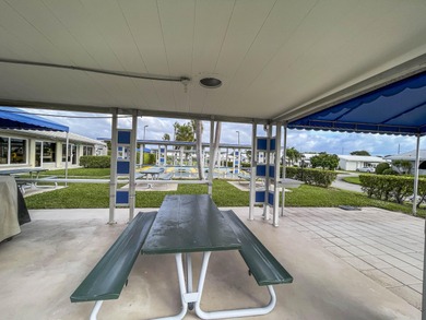 Enjoy the best of South Florida living in this beautifully on Leisureville Community Golf Course in Florida - for sale on GolfHomes.com, golf home, golf lot