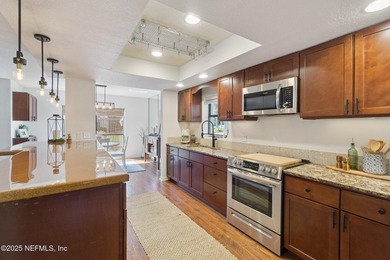 Beautifully updated end-unit in Deerwood's guard-gated community on The Deerwood Country Club in Florida - for sale on GolfHomes.com, golf home, golf lot