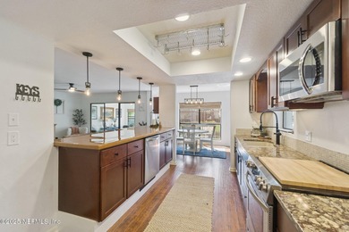 Beautifully updated end-unit in Deerwood's guard-gated community on The Deerwood Country Club in Florida - for sale on GolfHomes.com, golf home, golf lot