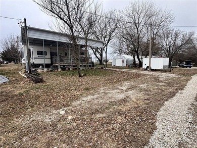 Check out this perfect set up for summer fun! Two camping lots on Linn Valley Lakes - Deer Trace Golf Course in Kansas - for sale on GolfHomes.com, golf home, golf lot