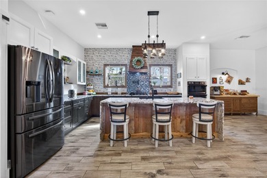 OVERSIZED LOT! UNIQUE 3 BEDROOM PLUS OFFICE, 3 BATH, 3 CAR on Riverwood Golf Club in Florida - for sale on GolfHomes.com, golf home, golf lot