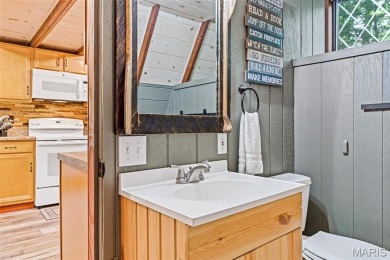 Say hello to summer at Wilderness Escape, a charming Innsbrook on Innsbrook Resort Golf Course in Missouri - for sale on GolfHomes.com, golf home, golf lot
