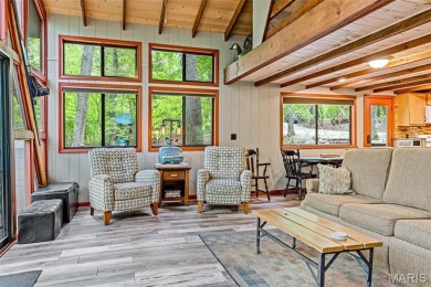 Say hello to summer at Wilderness Escape, a charming Innsbrook on Innsbrook Resort Golf Course in Missouri - for sale on GolfHomes.com, golf home, golf lot