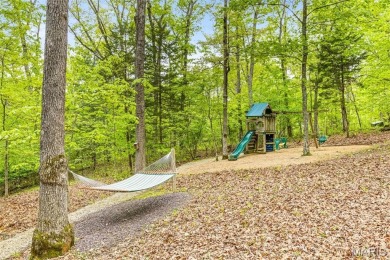 Say hello to summer at Wilderness Escape, a charming Innsbrook on Innsbrook Resort Golf Course in Missouri - for sale on GolfHomes.com, golf home, golf lot