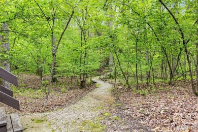 Say hello to summer at Wilderness Escape, a charming Innsbrook on Innsbrook Resort Golf Course in Missouri - for sale on GolfHomes.com, golf home, golf lot