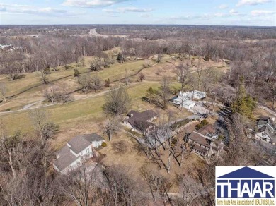 Discover an exceptional, executive property located on hole #14 on Country Club of Terre Haute in Indiana - for sale on GolfHomes.com, golf home, golf lot