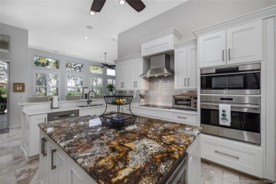 AMAZING show stopper 3B/3.5ba/2car gar., DEN & golf cart bay on Monarch Country Club in Florida - for sale on GolfHomes.com, golf home, golf lot