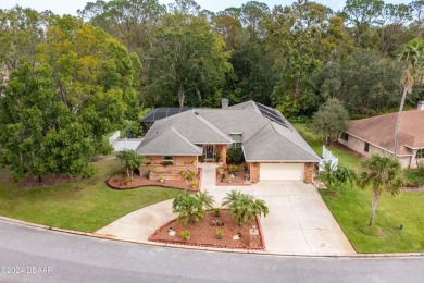 Custom concrete block home located in exclusive Spruce Creek on Spruce Creek Golf Club in Florida - for sale on GolfHomes.com, golf home, golf lot