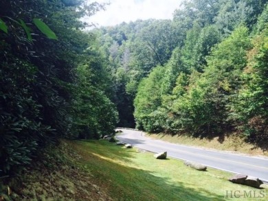 This 1 acre lot while gently sloping, overlooks the 17th green on Lake Toxaway Country Club in North Carolina - for sale on GolfHomes.com, golf home, golf lot