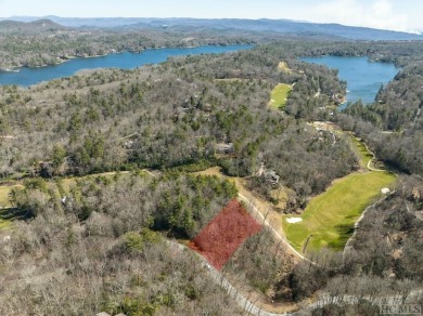 This 1 acre lot while gently sloping, overlooks the 17th green on Lake Toxaway Country Club in North Carolina - for sale on GolfHomes.com, golf home, golf lot