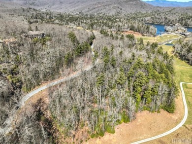 This 1 acre lot while gently sloping, overlooks the 17th green on Lake Toxaway Country Club in North Carolina - for sale on GolfHomes.com, golf home, golf lot