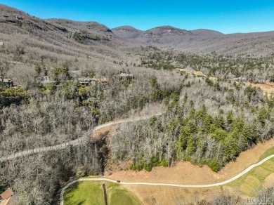 This 1 acre lot while gently sloping, overlooks the 17th green on Lake Toxaway Country Club in North Carolina - for sale on GolfHomes.com, golf home, golf lot