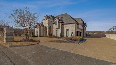 Luxury home with striking European architecture overlooking the on RidgePointe Country Club in Arkansas - for sale on GolfHomes.com, golf home, golf lot