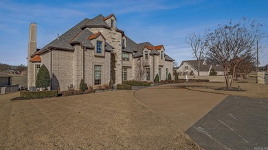 Luxury home with striking European architecture overlooking the on RidgePointe Country Club in Arkansas - for sale on GolfHomes.com, golf home, golf lot
