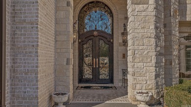 Luxury home with striking European architecture overlooking the on RidgePointe Country Club in Arkansas - for sale on GolfHomes.com, golf home, golf lot