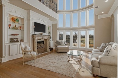 Luxury home with striking European architecture overlooking the on RidgePointe Country Club in Arkansas - for sale on GolfHomes.com, golf home, golf lot