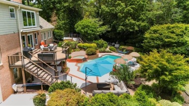 Nestled on a private, one-acre lot just moments from Highway 400 on Cherokee Town and Country Club in Georgia - for sale on GolfHomes.com, golf home, golf lot