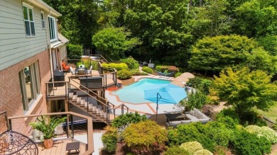 Nestled on a private, one-acre lot just moments from Highway 400 on Cherokee Town and Country Club in Georgia - for sale on GolfHomes.com, golf home, golf lot