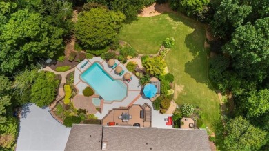 Nestled on a private, one-acre lot just moments from Highway 400 on Cherokee Town and Country Club in Georgia - for sale on GolfHomes.com, golf home, golf lot