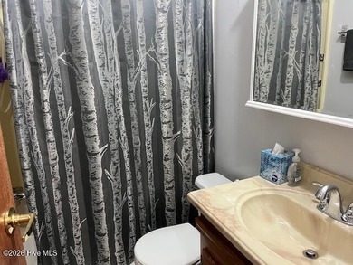 Located at the end of a cul-de-sac, this spacious 3BR/2BA home on Ocean Ridge Plantation in North Carolina - for sale on GolfHomes.com, golf home, golf lot