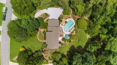 Nestled on a private, one-acre lot just moments from Highway 400 on Cherokee Town and Country Club in Georgia - for sale on GolfHomes.com, golf home, golf lot