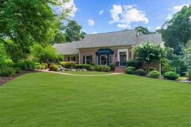 Nestled on a private, one-acre lot just moments from Highway 400 on Cherokee Town and Country Club in Georgia - for sale on GolfHomes.com, golf home, golf lot