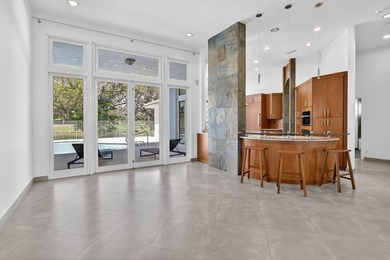 Totally updated kitchen and bathrooms in this four bedroom, 3 on  in Florida - for sale on GolfHomes.com, golf home, golf lot