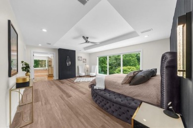 Nestled on a private, one-acre lot just moments from Highway 400 on Cherokee Town and Country Club in Georgia - for sale on GolfHomes.com, golf home, golf lot