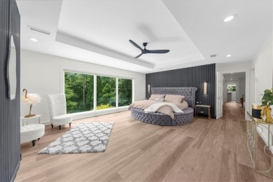 Nestled on a private, one-acre lot just moments from Highway 400 on Cherokee Town and Country Club in Georgia - for sale on GolfHomes.com, golf home, golf lot