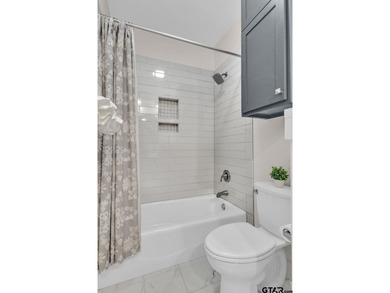 This beautifully updated home strikes that perfect balance on Hide-A-Way Lake Golf Course in Texas - for sale on GolfHomes.com, golf home, golf lot