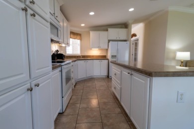 MOTIVATED SELLER!!! A comparable park model (lot 1447, 1,568 sq on Lily Lake Golf and RV Resort in Florida - for sale on GolfHomes.com, golf home, golf lot