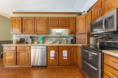 This spacious quad-level home is nestled on a double wooded lot on Savannah Oaks Golf Club of Candlewick Lake in Illinois - for sale on GolfHomes.com, golf home, golf lot