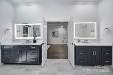 Ideally situated on a picturesque 1-acre lot in Lake Norman's on Trump National Golf Club Charlotte in North Carolina - for sale on GolfHomes.com, golf home, golf lot
