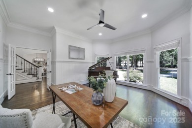 Ideally situated on a picturesque 1-acre lot in Lake Norman's on Trump National Golf Club Charlotte in North Carolina - for sale on GolfHomes.com, golf home, golf lot