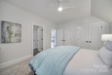 Ideally situated on a picturesque 1-acre lot in Lake Norman's on Trump National Golf Club Charlotte in North Carolina - for sale on GolfHomes.com, golf home, golf lot
