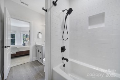 Ideally situated on a picturesque 1-acre lot in Lake Norman's on Trump National Golf Club Charlotte in North Carolina - for sale on GolfHomes.com, golf home, golf lot