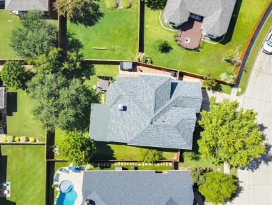 Stunning brick 2 story Sachse home in Woodbridge on a large on Woodbridge Golf Club in Texas - for sale on GolfHomes.com, golf home, golf lot