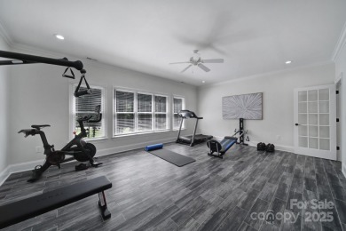 Ideally situated on a picturesque 1-acre lot in Lake Norman's on Trump National Golf Club Charlotte in North Carolina - for sale on GolfHomes.com, golf home, golf lot