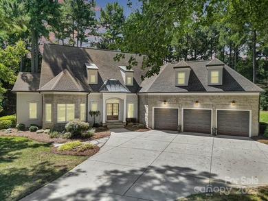 Ideally situated on a picturesque 1-acre lot in Lake Norman's on Trump National Golf Club Charlotte in North Carolina - for sale on GolfHomes.com, golf home, golf lot