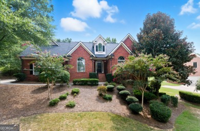 Step inside to find gleaming hardwood floors throughout the main on Chapel Hills Golf and Country Club in Georgia - for sale on GolfHomes.com, golf home, golf lot