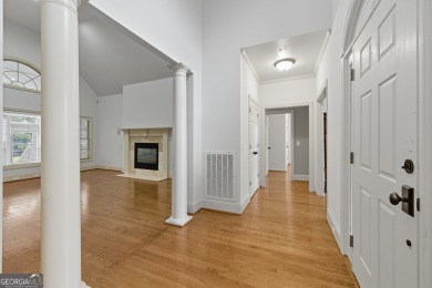 Step inside to find gleaming hardwood floors throughout the main on Chapel Hills Golf and Country Club in Georgia - for sale on GolfHomes.com, golf home, golf lot