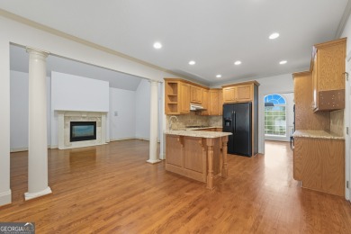 Step inside to find gleaming hardwood floors throughout the main on Chapel Hills Golf and Country Club in Georgia - for sale on GolfHomes.com, golf home, golf lot