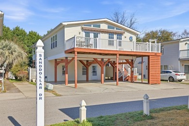 Just a short walk to the Atlantic ocean, this spacious raised on Tupelo Bay Golf Complex  in South Carolina - for sale on GolfHomes.com, golf home, golf lot