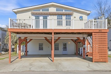 Just a short walk to the Atlantic ocean, this spacious raised on Tupelo Bay Golf Complex  in South Carolina - for sale on GolfHomes.com, golf home, golf lot